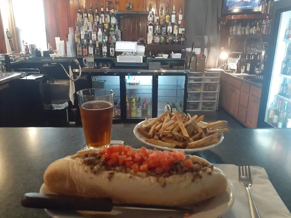 Cheesesteak and Fries with an Ice Cold Lager